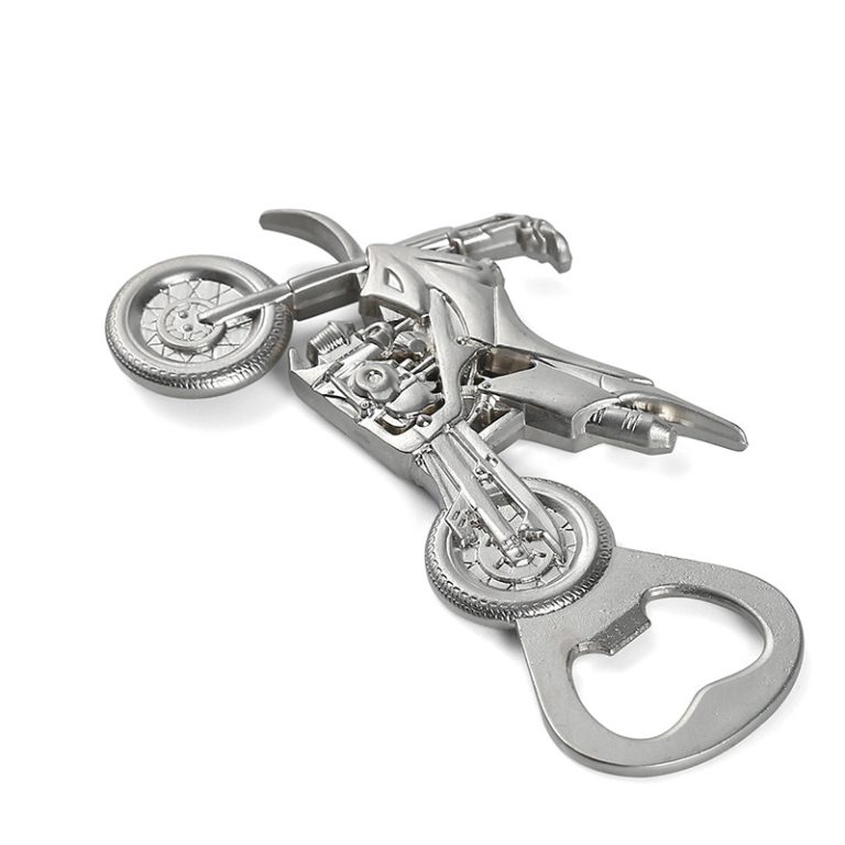 Silver motorcycle-shaped bottle opener on white background.