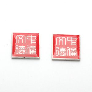 Red mahjong tiles with white Chinese characters.