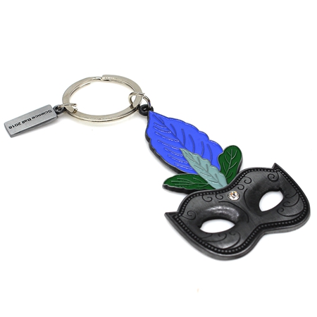 Black masquerade mask with blue and green feather keychain.