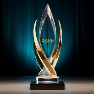 Elegant crystal and gold GANN award trophy on display.