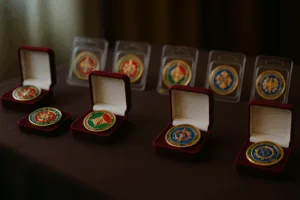An elegant display of custom challenge coins in premium packaging, showcasing colorful enamel, engraving, and specialty edges ready for gifting or ceremony.