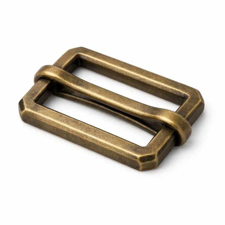 Realistic studio image of an adjustable slider buckle featuring a brass look with an antique brass finish. It showcases a sandblasted matte surface and crisp beveled edges for a vintage, premium design suitable for metal craft applications.