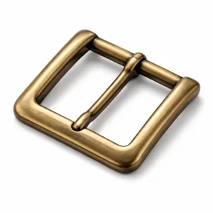 Solid antique brass buckle in a classic rectangular shape with a smooth polished surface and softly rounded edges. The antique brass finish emphasizes a subtle sheen, and the commercial lighting highlights its contours, perfect for main e-commerce display.