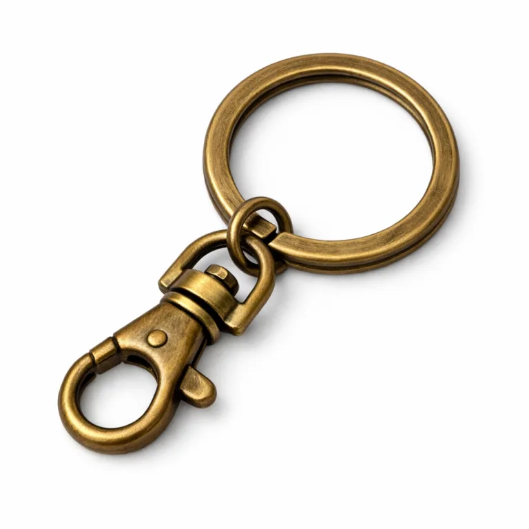 A round antique brass keychain featuring a brushed surface for a subtle texture, attached to a classic split ring. The piece displays soft rounded edges and a warm antique brass tone, photographed against a clean white studio background for clear e-commerce presentation.