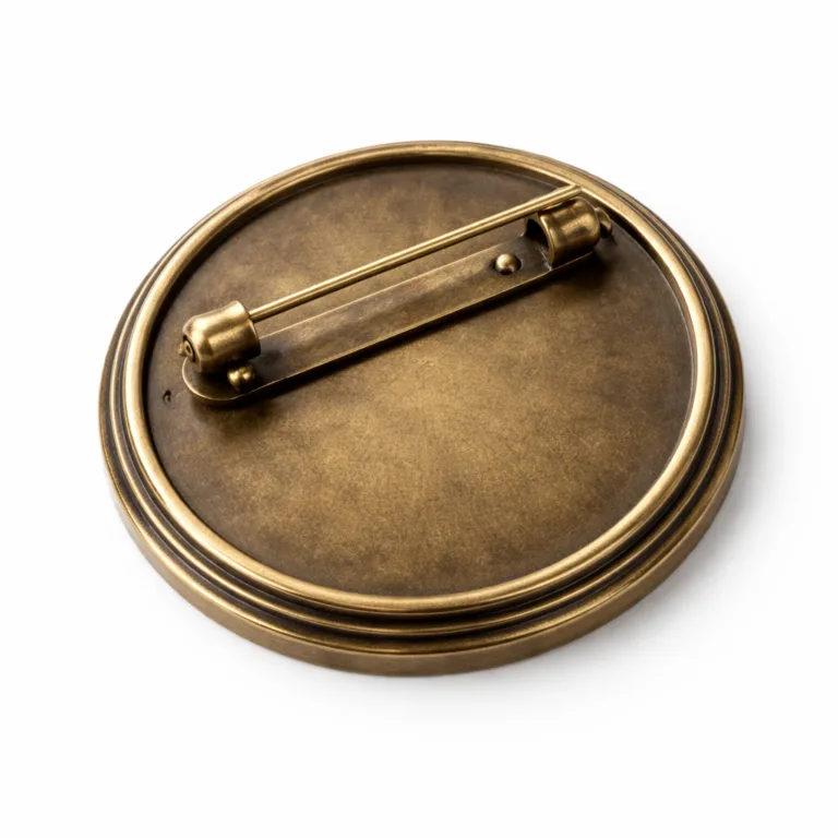 High-realism product photo of a round antique brass vintage badge featuring a crisp beveled edge and classic pin back attachment. Manufactured in solid brass with an antique finish, ideal for heritage or retro-themed branding.