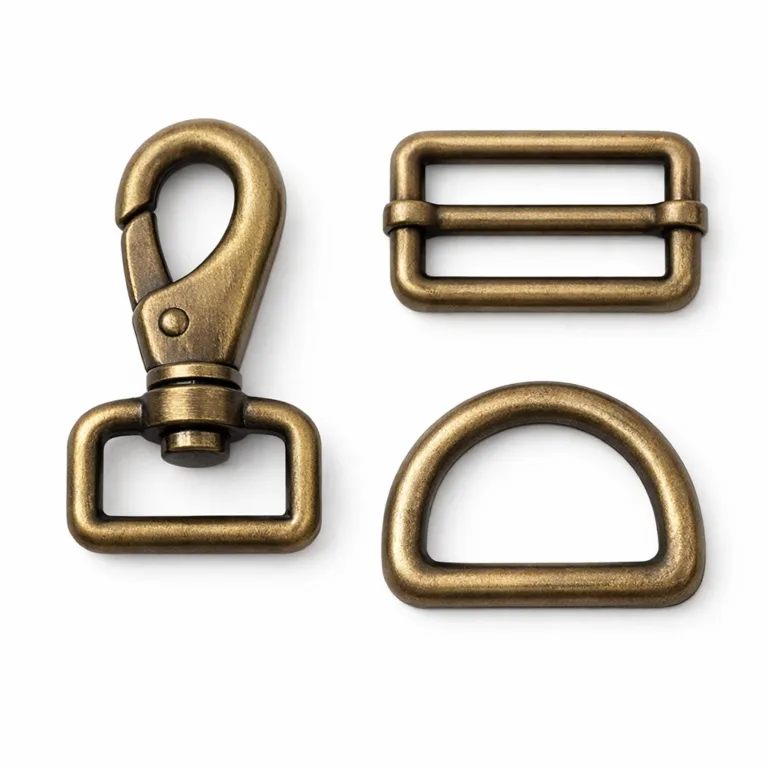 A bag strap buckle hardware variant produced in brass, featuring an antique brass finish with a brushed surface texture and gently rounded edge. The timeless design suits classic or vintage-style bags, captured with sharp detail on a white background.