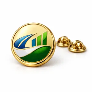 A polished gold round corporate brand badge crafted from zinc alloy, featuring a crisp beveled edge, engraved and color-filled emblem, and a secure butterfly clutch backing—ideal for office uniforms or events.