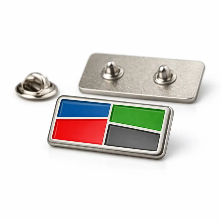 Rectangular corporate badge in brushed nickel finish, zinc alloy base, featuring a soft rounded edge and vibrant soft enamel-filled engraved logo, attached with a butterfly clutch for secure wear.