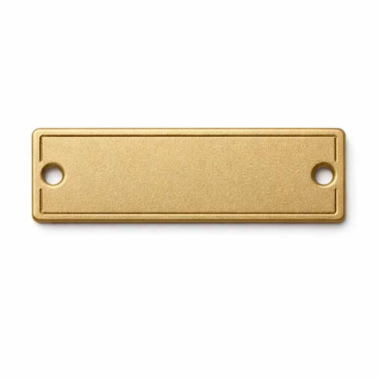 A rectangular debossed nameplate tag manufactured from brass with a sandblasted matte gold finish, giving a subtle texture. The tag has a completely flat 2D profile with no enamel fills, offering a classic and sophisticated look.