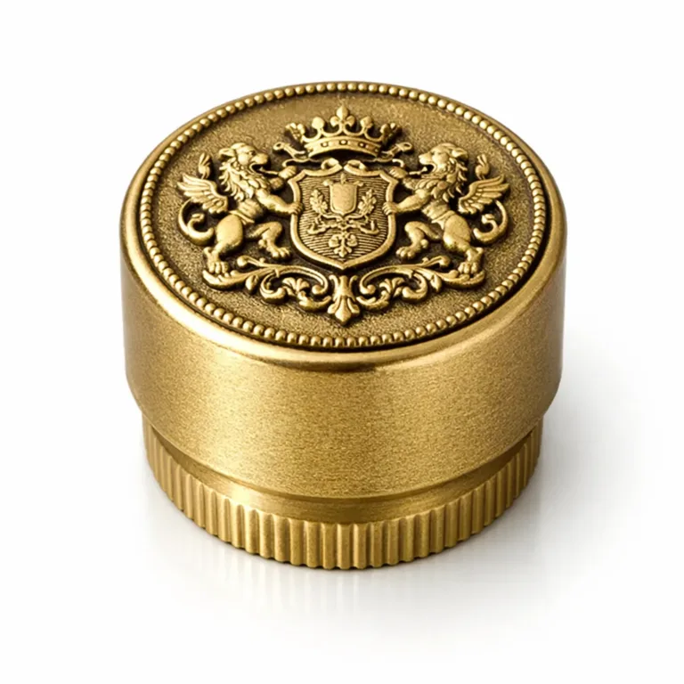 A zinc alloy bottle cap in antique gold plating, showcasing a sandblasted matte surface and intricate 3D relief on the top, enhancing the crafted look in product photography.