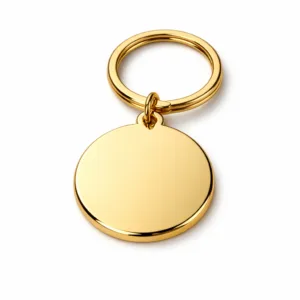 High realism product photo of a gold-plated flat round keychain, polished to a mirror sheen, with a zinc alloy base and standard split ring attachment. Ideal for e-commerce presentation.