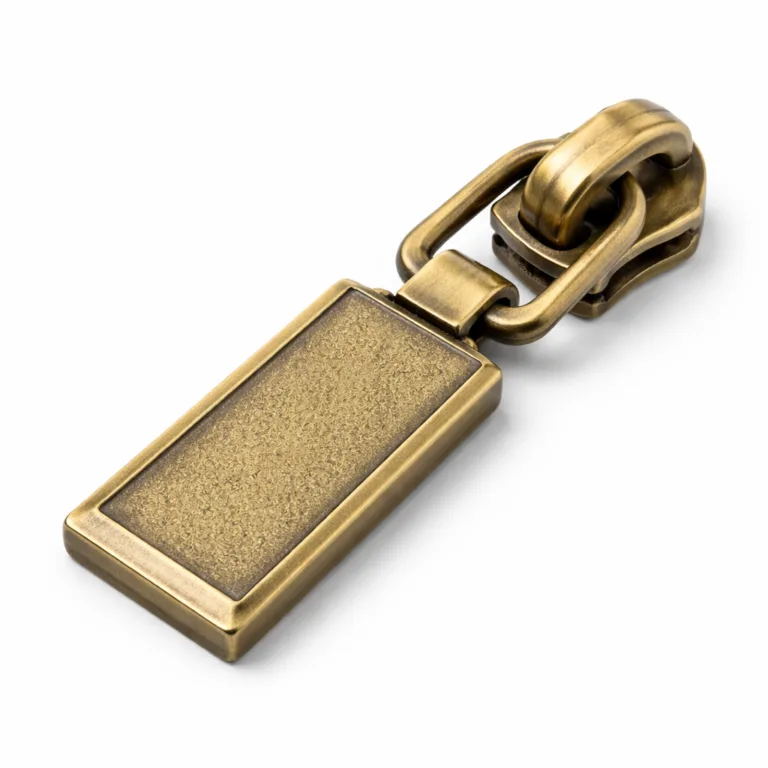 A stylish antique brass handbag metal zipper pull, rectangular with sharply beveled edges and a sandblasted matte surface. Offers a vintage look suitable for classic or retro handbags.