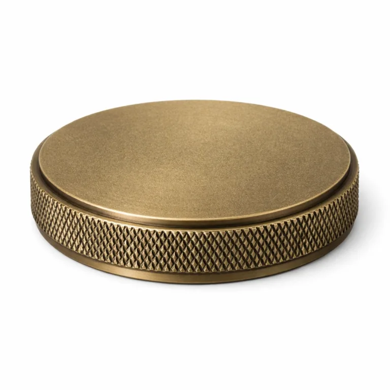 A 2D flat-edged knurled grip metal closure in an antique brass finish with a sandblasted matte surface, highlighting a classic, vintage hardware style suitable for various closures and lids.