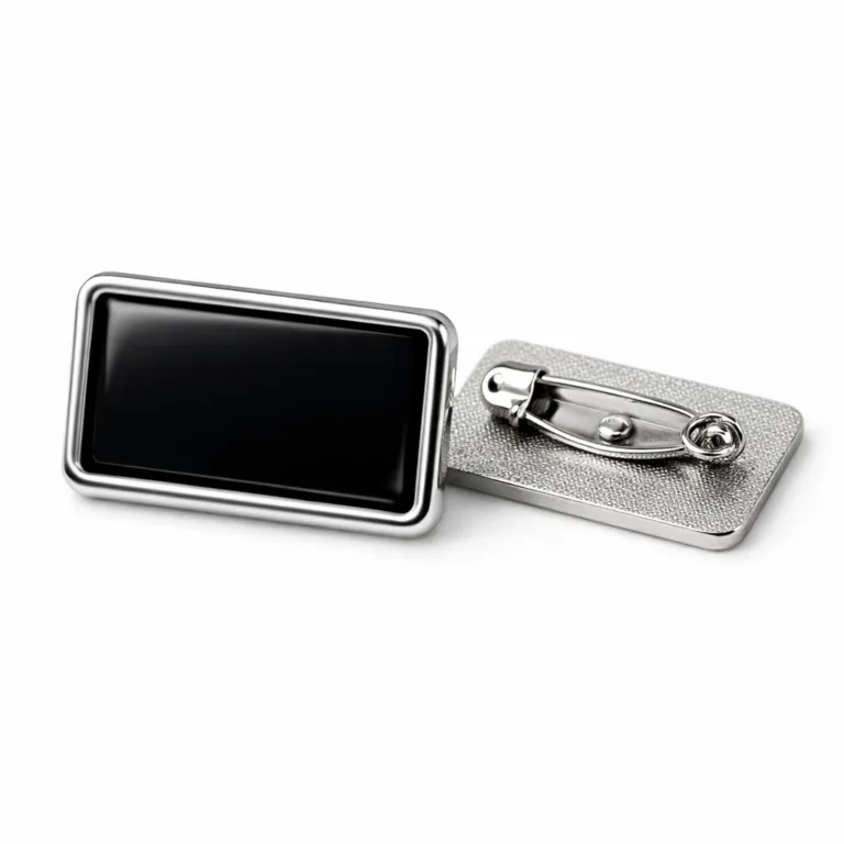 A modern rectangular lapel pin badge in a shiny nickel finish, featuring soft rounded edges, deep black soft enamel color fill, and a secure safety pin back for easy attachment.
