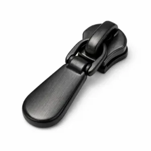 A matte black zipper puller crafted from zinc alloy with a brushed surface texture and soft rounded edges, photographed in a studio on a white background for sharp detail and realism.