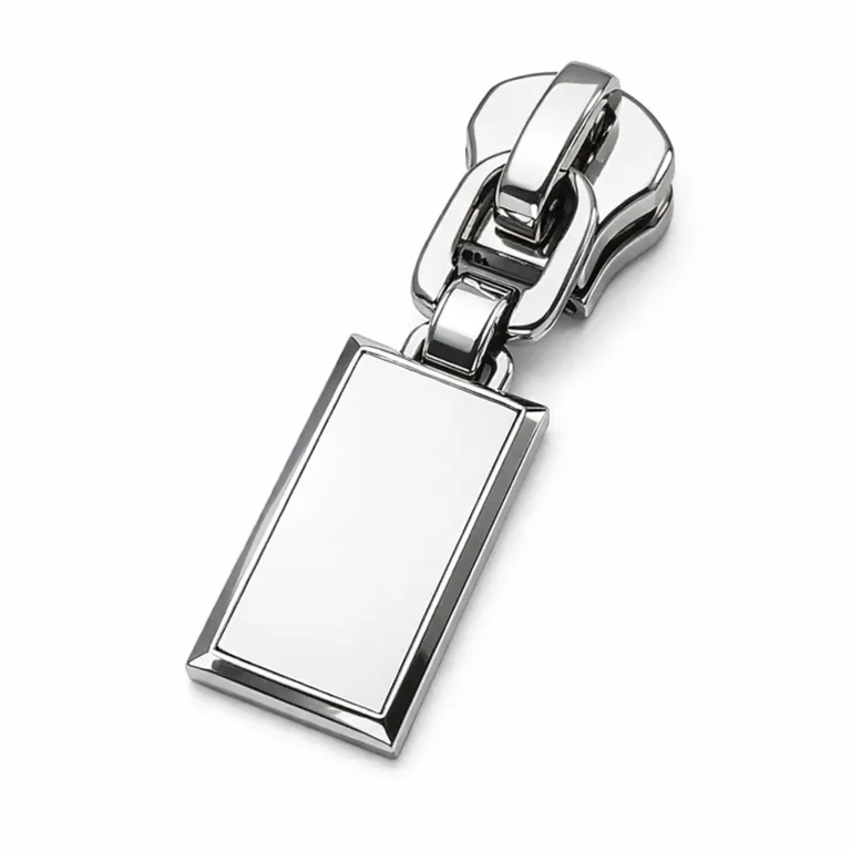 gr metal zipper nickel flat A high-resolution product photo of a metal zipper puller featuring a shiny nickel finish, 2D flat rectangular design, and a branded emblem. The edges are crisp and beveled for a modern look.