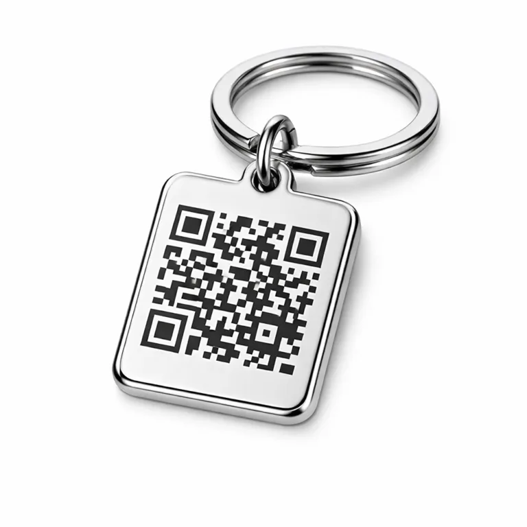 A highly detailed photo of a rectangular QR code keychain tag made of zinc alloy with a polished silver finish. The tag features a soft rounded edge and a flat 2D surface, attached to a classic split key ring. Designed for e-commerce with true-to-life lighting on a plain white background.