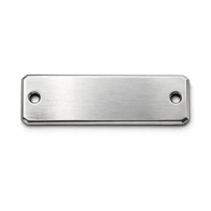E-commerce studio photo of a brushed silver zinc alloy sew-on metal brand tag, rectangular with beveled edges, two precisely drilled sewing holes at each end. High clarity, neutral white background, sharp details perfect for online listing.