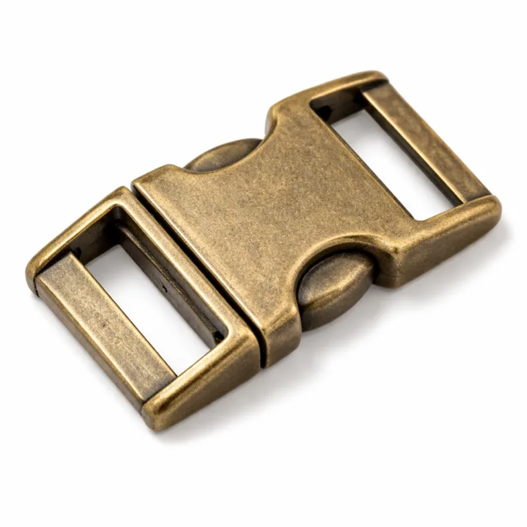 A detailed studio photo of a side-release metal buckle in an antique brass finish, featuring a sandblasted matte texture and soft, rounded edges. This variant offers a vintage appearance suitable for classic or retro-styled accessories.