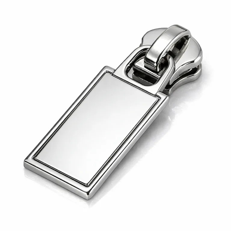 gr stamped zipper nickel beveled A commercial studio photo of a rectangular zipper pull plate crafted from zinc alloy with a shiny nickel plating and crisp beveled edges, showcasing its elegant and durable appearance for high-end accessories.