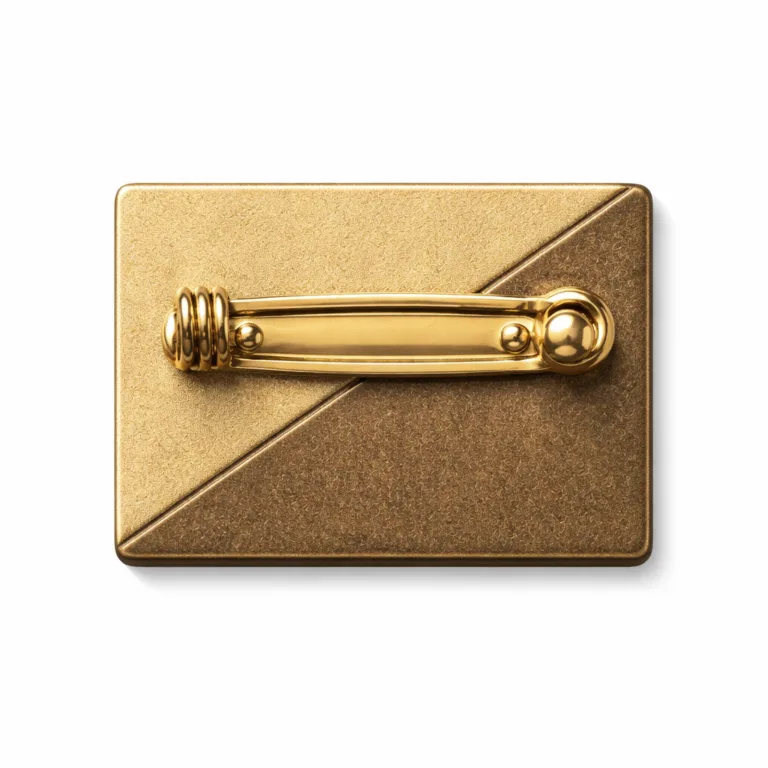 An antique brass and gold two-tone clasp in a flat 2D shape with sandblasted matte finish, featuring a standard safety pin back attachment. Crafted from brass alloy, ideal for badges and pins, perfectly lit against a white background.