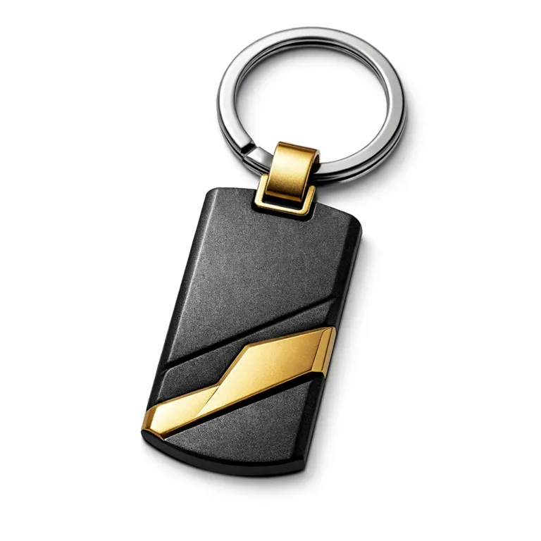 High-detail studio photo of a two-tone metal keychain featuring a sandblasted matte black nickel paired with a gold finish. The body showcases intricate 3D relief and is fitted with a split ring for easy use.