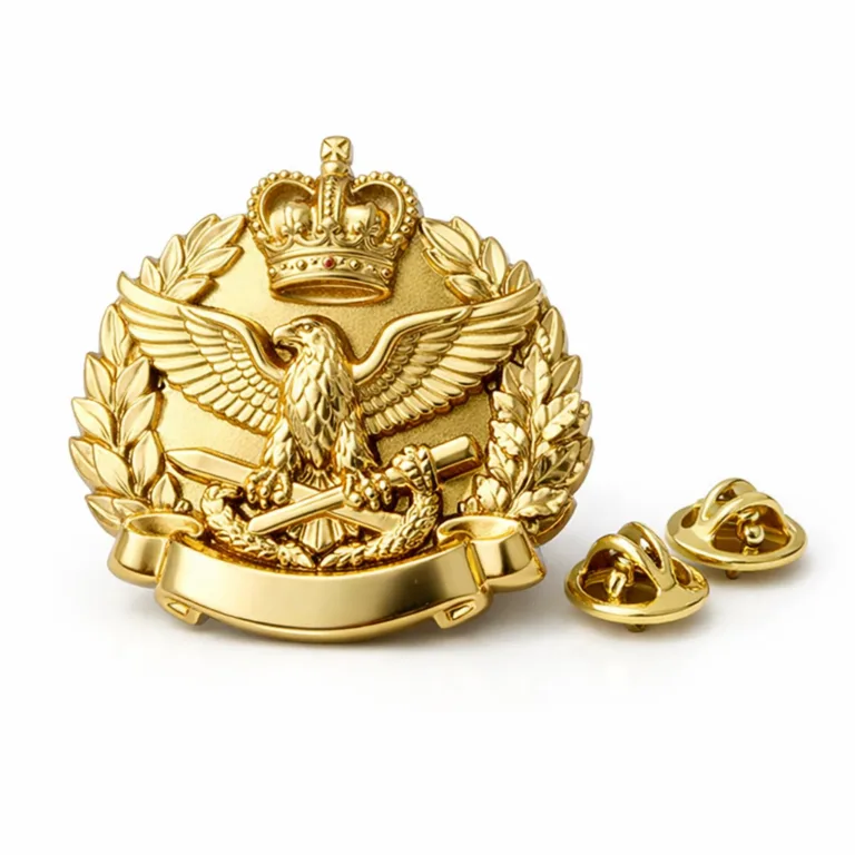 Premium uniform cap badge featuring a polished gold finish and 3D relief emblem. The edges are softly rounded for comfort. Butterfly clutch attachment is included for secure fitting on caps.