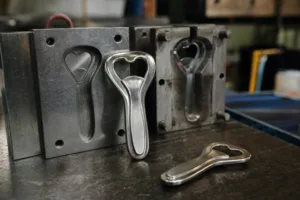 A realistic manufacturing image highlighting zinc alloy 3D bottle opener molds, cast parts, and the solid premium character of the product.
