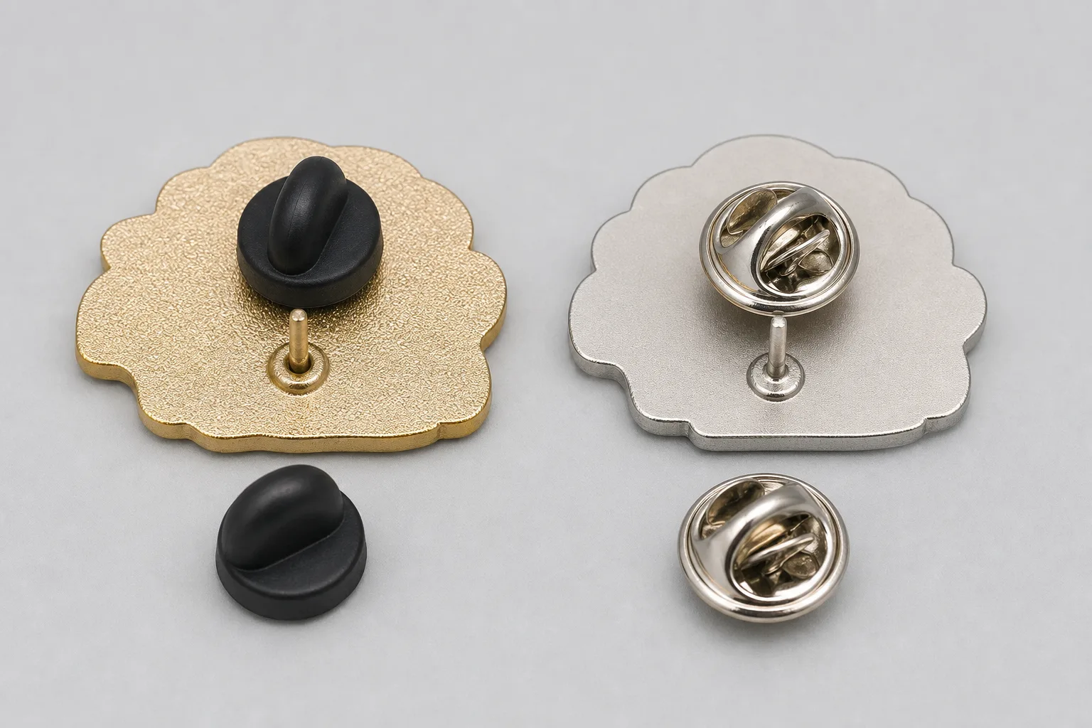 Rear view comparison of a rubber clutch and metal butterfly clutch on custom pins
