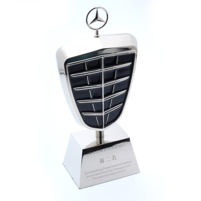 Mercedes emblem trophy for environmental safety achievement.